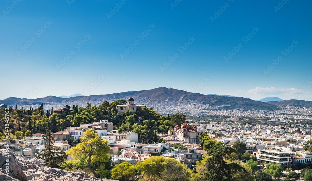 Panoramic cityscape view of National Observatory of Athens and Church of St Marina in Thissio in Athens city, Greece