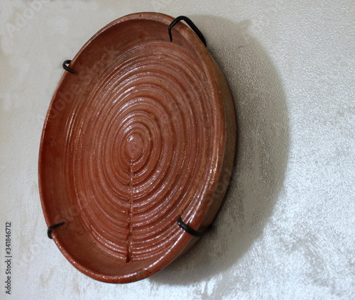 Handmade traditional ceramic tray used to drain rennet from fresh cheese