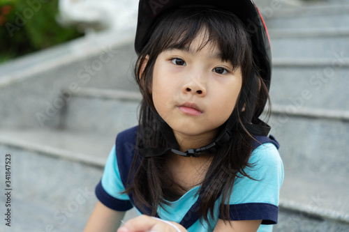 Portrait cute child girl asian beautiful 7 years old Concept Exercise in the park 