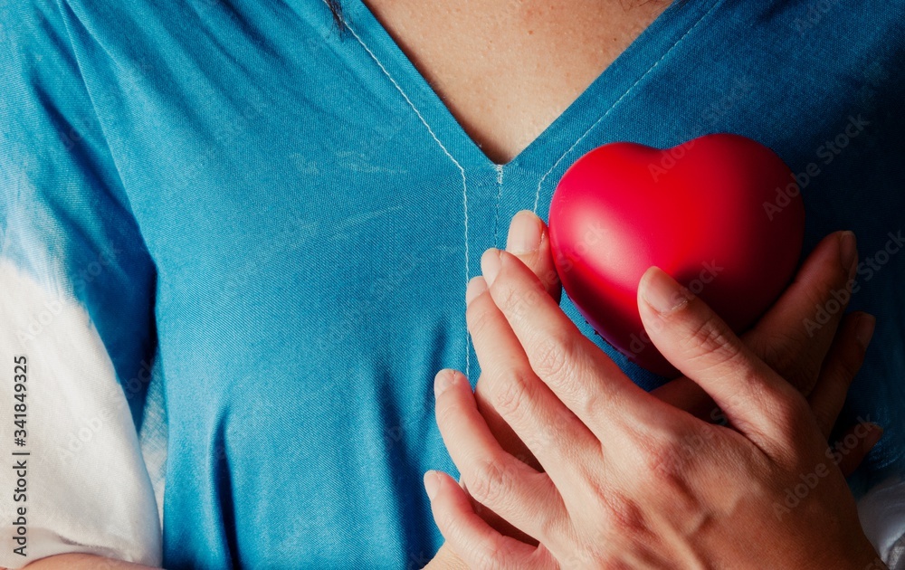 Woman hand holding red heart, health care, donate and family insurance concept, world heart day, world health day,CSR responsibility, adoption foster family, hope, gratitude, kind, concept Woman hand holding red heart, health care, donate and family insurance concept, world heart day, world health day,CSR responsibility, adoption foster family, hope, gratitude, kind, concept
