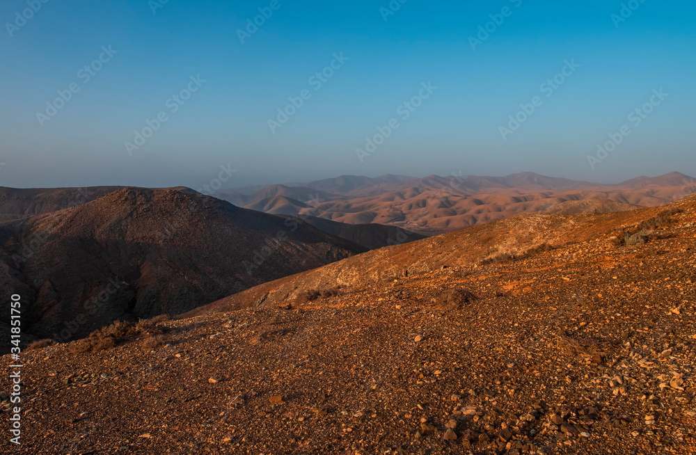 Panoramic view at volcanic landscape nearby Pajara on canary island Fuerteventura. Sunset in october 2019