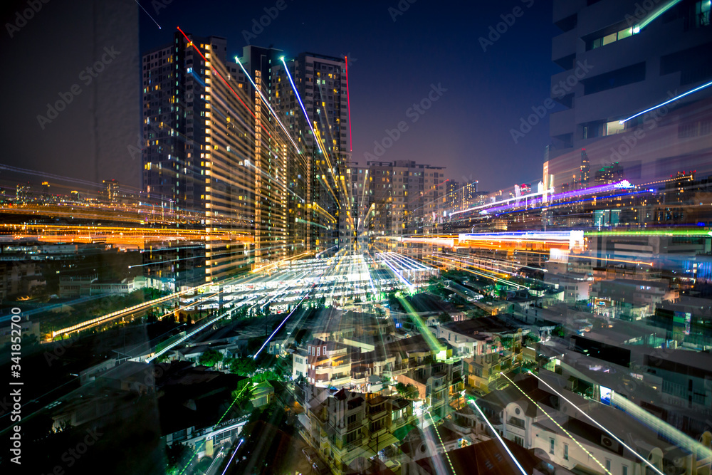 Blurred abstract background of light lines from the capital's residences in condominiums, offices, street lights from shopping malls, nighttime beauty Blurred abstract background of light lines from the capital's residences in condominiums, offices, street lights from shopping malls, nighttime beauty