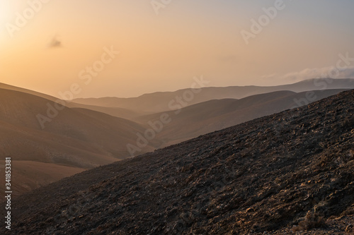 Panoramic view at volcanic landscape nearby Pajara on canary island Fuerteventura. Sunset in october 2019