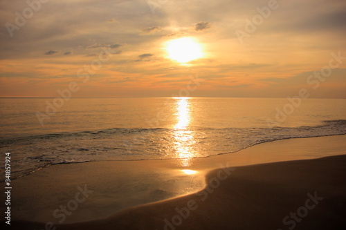 Sea or beach on twilight sky and on the sunset for background.