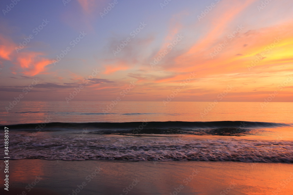Sea or beach on twilight sky and on the sunset for background.