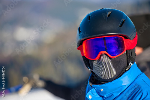Portrait of a skier wearing googles after a fun day of skiing. © FS-Stock