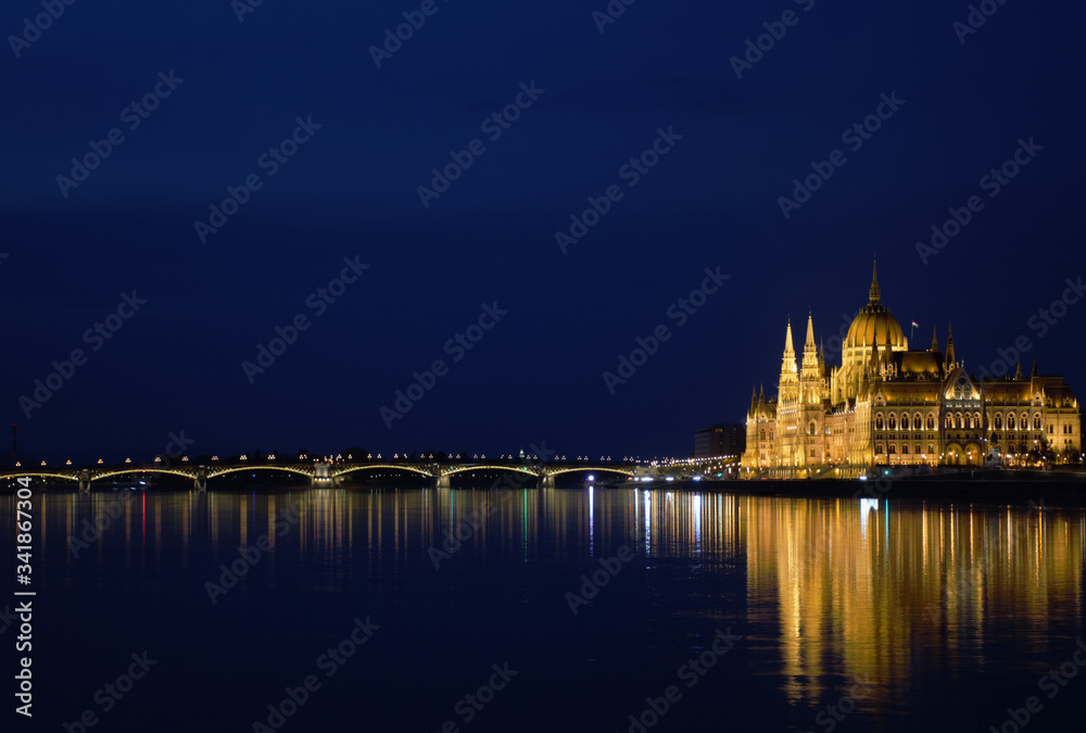 Parliament Palace and the bridge over the Danube in Budapest at night