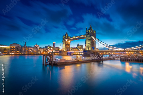 Famous Tower Bridge over themes river London at night London  Aerial view to the illuminated Tower Bridge and skyline of London