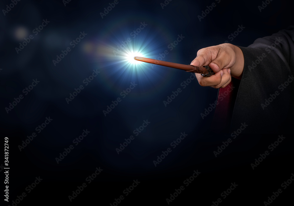Magic wand on mysterious background, Miracle magical stick Wizard tool on black - obrazy, fototapety, plakaty 