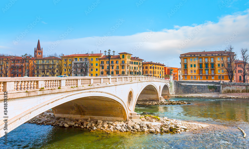 Historical bridge of Victory (Ponte della Vittoria) across the Adige River in the center of Verona - Verona, Italy,  