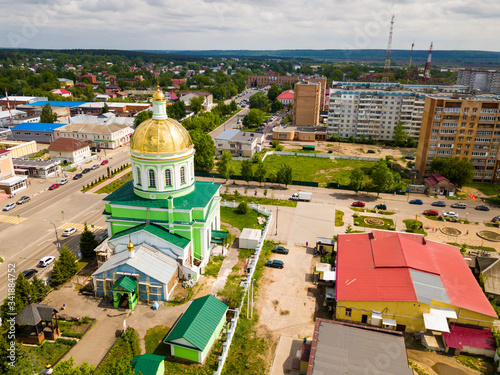 Ozyory, Russia - May 13, 2019: Picturesque view from the height of the Holy Trinity Church and residential buildings. City of Ozyory. Moscow region. Russia photo