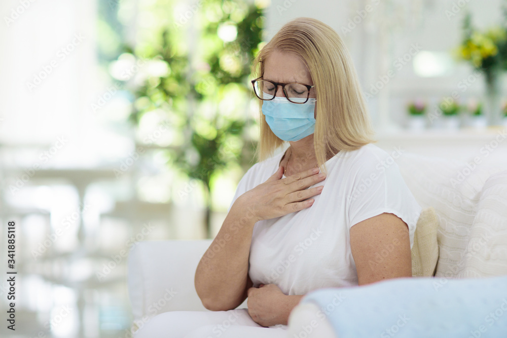 Sick woman in face mask. Ill senior coughing. Sick woman in face mask. Ill senior coughing.