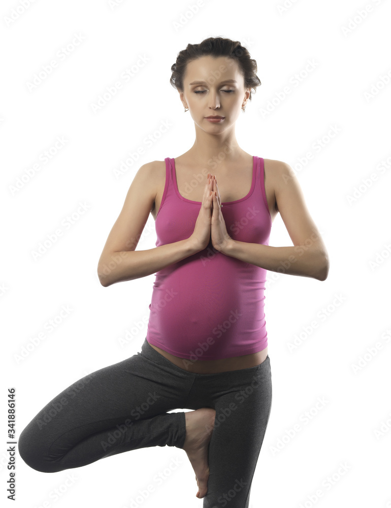 Young pregnant girl doing yoga
Young pregnant girl doing yoga
