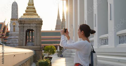 Photography Woman go travel and take photo on cellphone at bangkok