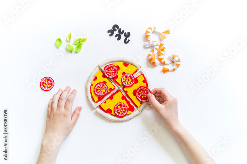 Montessori material. Felt pizza. Children s hands.