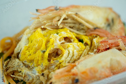 Thai Style Fried Noodle shrimp with omelet and vegetables