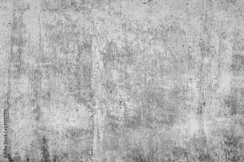 Gray concrete surface with cracks. An image of a cemented surface with a grunge, dirty stain, as an idea for making a background.