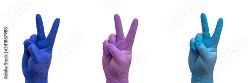 end of quarantine, pandemic of the coronavirus. hand with medical glove doing the Victory gesture