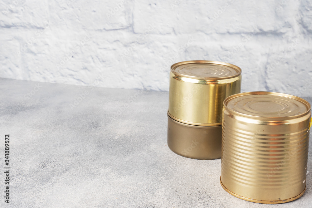 Tin cans with canned food. Copy space. Concept of food storage, donations. Tin cans with canned food. Copy space. Concept of food storage, donations.
