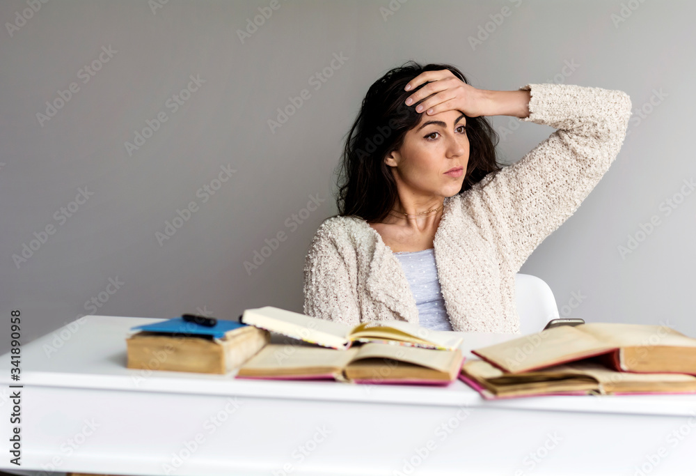 Tired Student Woman with Headache Studying for Exams Tired Student Woman with Headache Studying for Exams