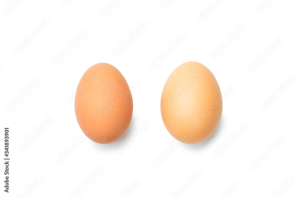 Two fresh brown chicken eggs on a white background Two fresh brown chicken eggs on a white background