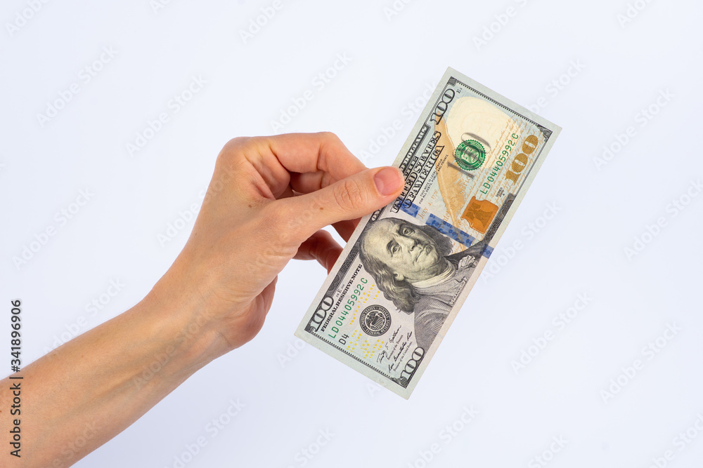handing over a one hundred dollar bill, as payment for services or purchase handing over a one hundred dollar bill, as payment for services or purchase