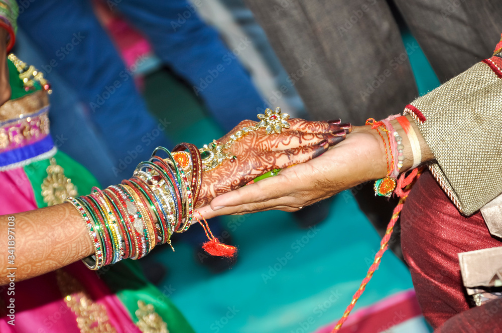 Indian couple's hand in hand in a wedding, Indian marriage traditions
