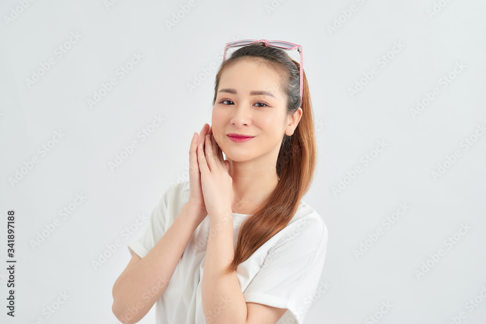 young attractive asian woman relaxing over white background young attractive asian woman relaxing over white background