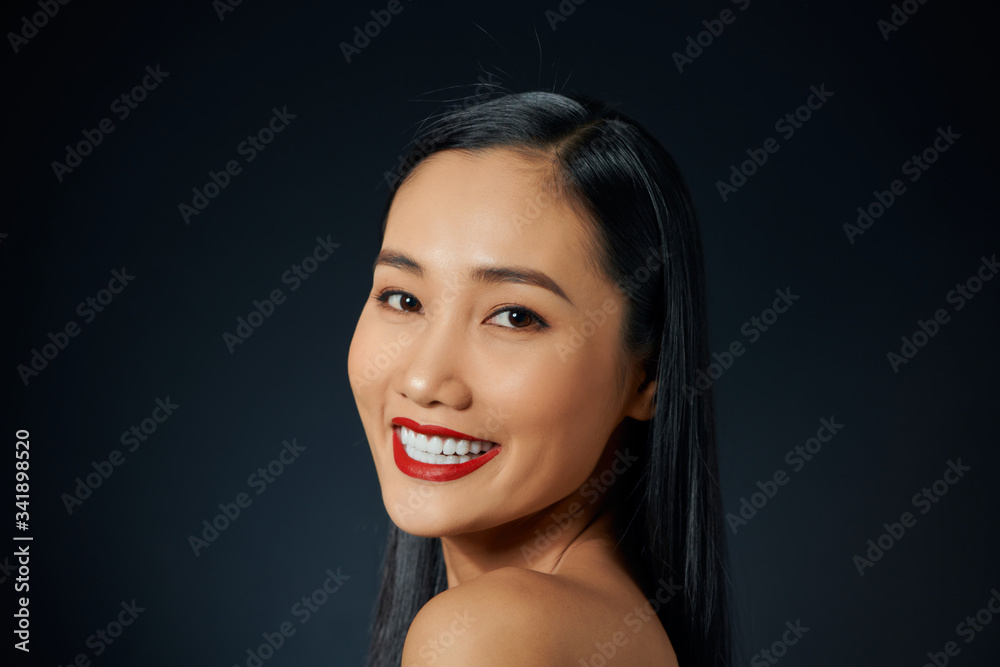 Portrait of Vietnamese young woman looking at the camera
