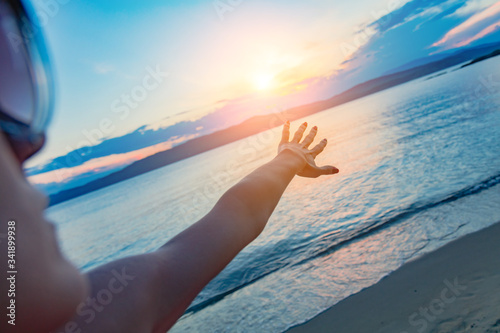 Silhouette of a girl enjoying at ocean   sea shore in sunset time.