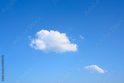 Closeup of beautiful white clouds with blue clear sky background