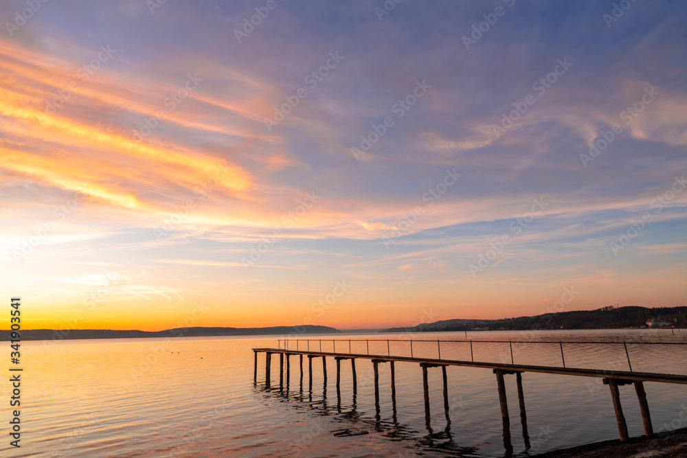 Pier and bridge on the sea, beautiful sunset, dramatic sky background