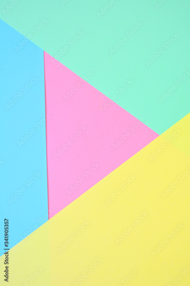 Beautiful pastel abstract trend background with yellow, mint, blue and pink (dusty rose). Light texture, blank. Flat lay, top view, copy space.
