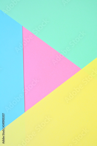 Beautiful pastel abstract trend background with yellow, mint, blue and pink (dusty rose). Light texture, blank. Flat lay, top view, copy space. 
