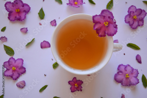 Gourmet concept. Elegant spring (summer) drink.Сup of tea with flowers .Аromatic hot drink. Healthy lifestyle. herbal tea.Top view