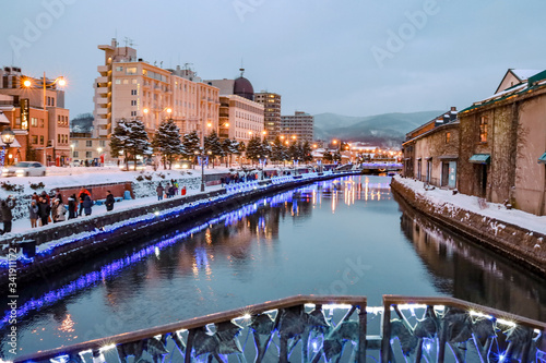 Obraz na płótnie Otaru Canal in Winter with twilight light. One of Beautiful scene in Otaru canal with old warehouses. It is a popular tourist attraction of Hokkaido, Japan. w salonie