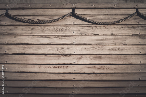 Принти на полотні The side of an old wooden boat with ship rope