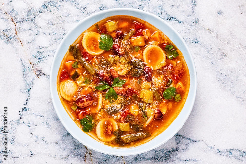 Minestrone, italian vegetable soup with pasta and beans.