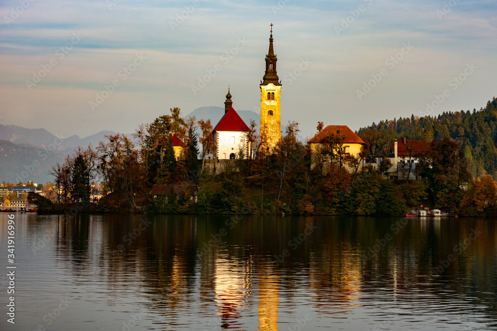 bled lake at sunset and lights reflected on the water