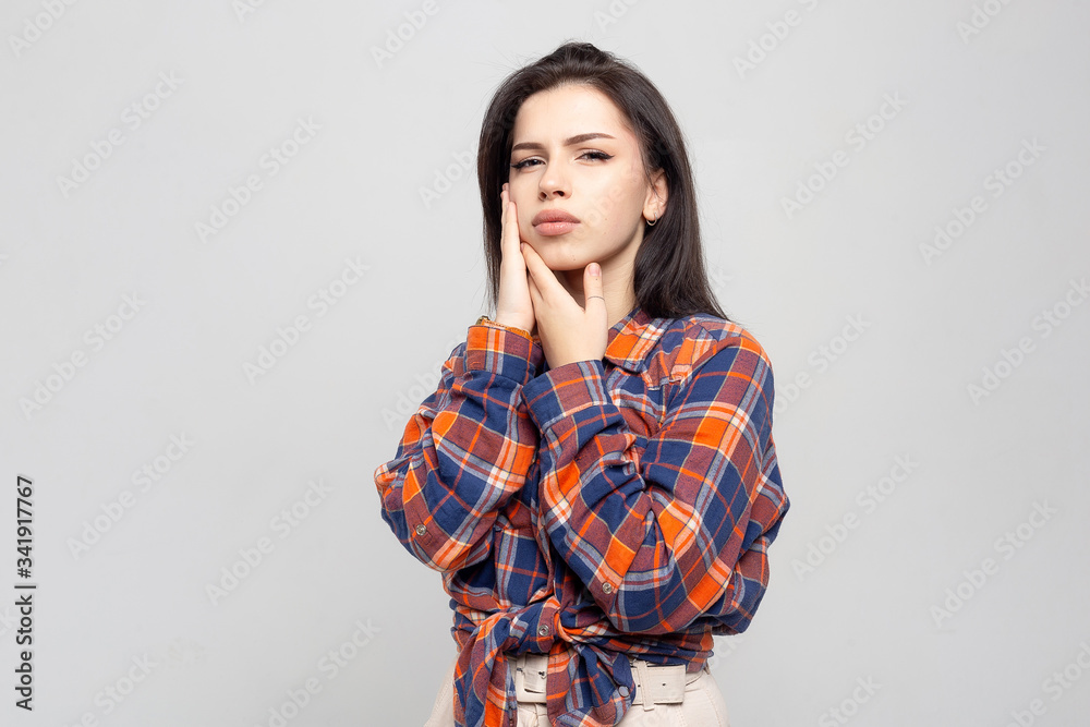 Tooth Pain And Dentistry. Beautiful Young Woman Suffering From Terrible Strong Teeth Pain, Touching Cheek With Hand. Female Feeling Painful Toothache. Dental Care And Health Concept. Tooth Pain And Dentistry. Beautiful Young Woman Suffering From Terrible Strong Teeth Pain, Touching Cheek With Hand. Female Feeling Painful Toothache. Dental Care And Health Concept.