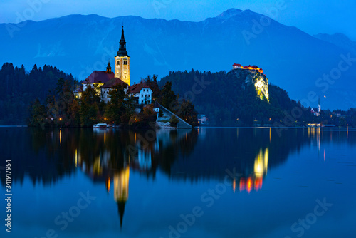 bled lake at sunset and lights reflected on the water