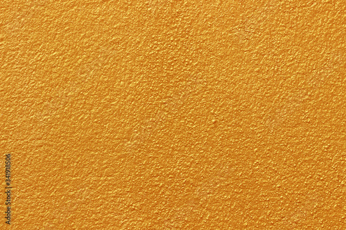 Gold paint on cement wall texture or backgrond
