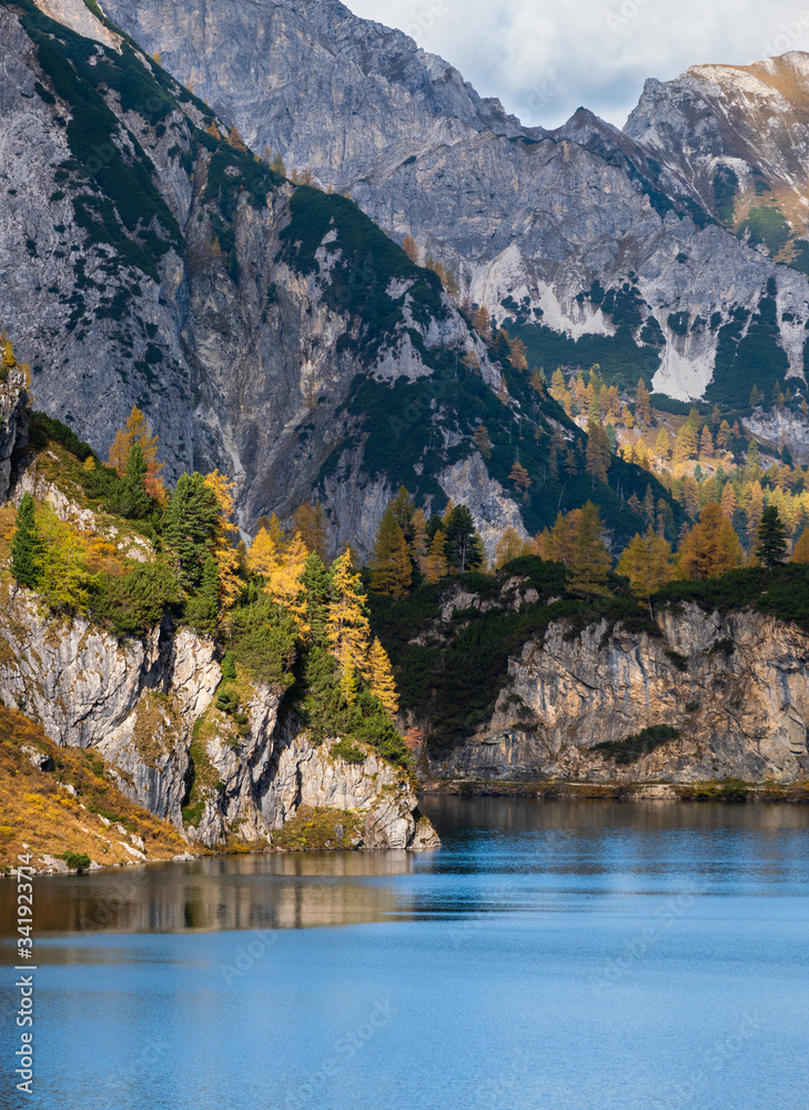 Sunny autumn alpine Tappenkarsee lake and rocky mountains above, Kleinarl, Land Salzburg, Austria. Sunny autumn alpine Tappenkarsee lake and rocky mountains above, Kleinarl, Land Salzburg, Austria.