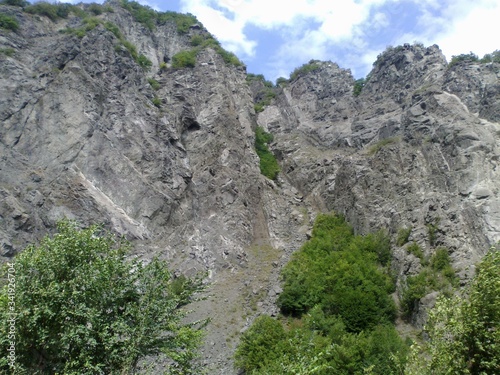 Obraz na płótnie Lahic, Ismayilli region, Azerbaijan - August 22, 2012. Mountainous road leading to Lahic village in Ismayilli region of Azerbaijan, with car. w salonie