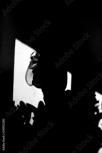 silhouette of a woman in a window