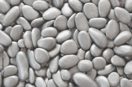Close up natural grey pebbles, texture of decorative stone gravel for background and design.