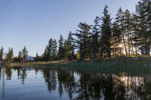 in a lake of calm blue water the aroles of the coast are reflected, clear day and blue sky