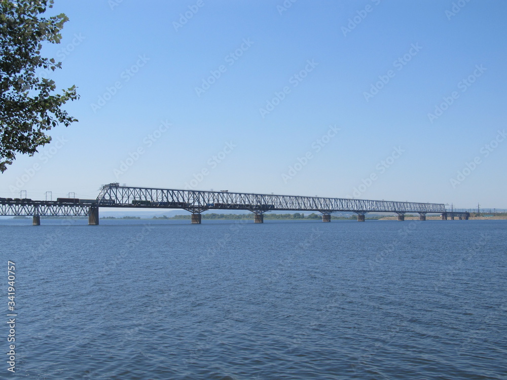 Railway bridge over the river. Sunny spring day.