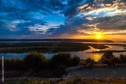 Landscape with sunset on the river in summer