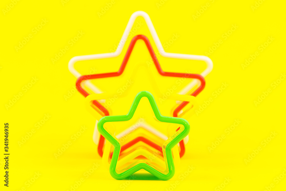 Star shapes isolated on yellow background.